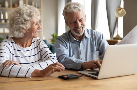 Couple looking at services provided by SpineArt